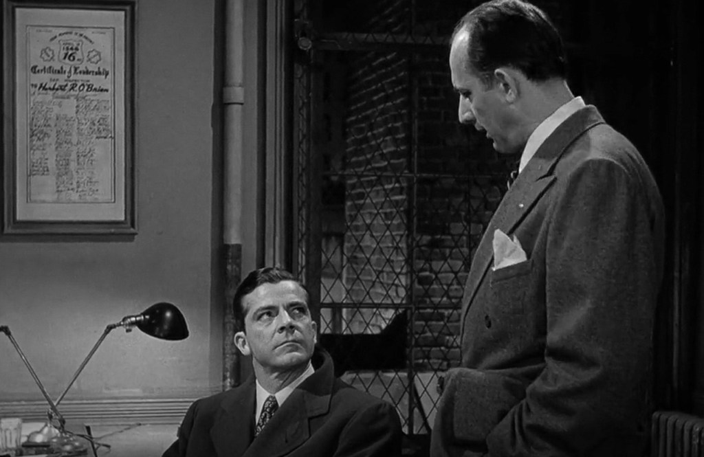 A scene from film Where the Sidewalk Ends featuring Dana Andrews as Detective Mark Dixon and Tom Tully as Jiggs Taylor.